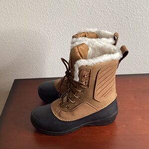 The North Face Shellista IV Mid Waterproof Winter Boots With Faux Fur Collar.